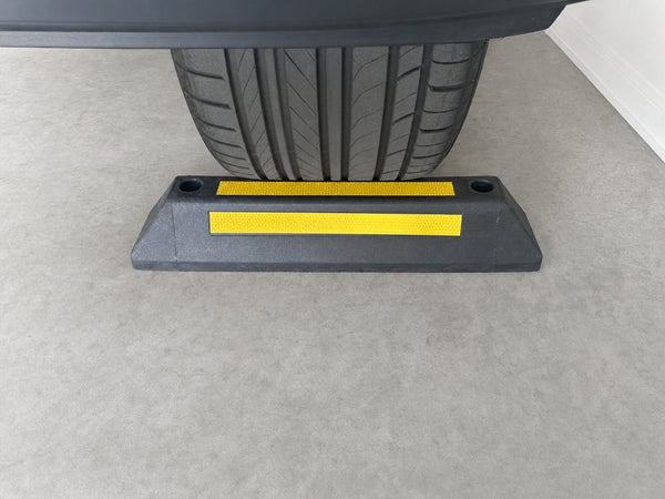 EV charger protected by yellow bollards in an Australian commercial car park